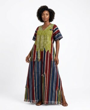 Woman wearing a handwoven burgundy and blue striped Ghanaian Gonja maxi dress with green embroidered chest panel.