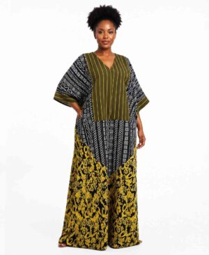 Woman wearing a floor-length African kaftan dress with mixed olive stripes, black mudcloth patterns, and mustard yellow prints.
