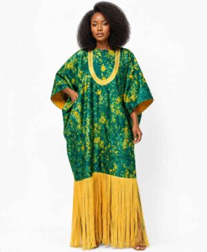 Model wearing a forest green and mustard yellow African print maxi kaftan with long fringe and embroidered neckline.