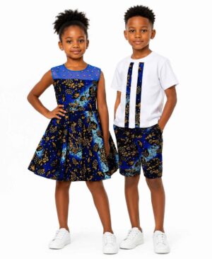 A young boy and girl standing together wearing matching royal blue and gold floral African print Ankara outfits.