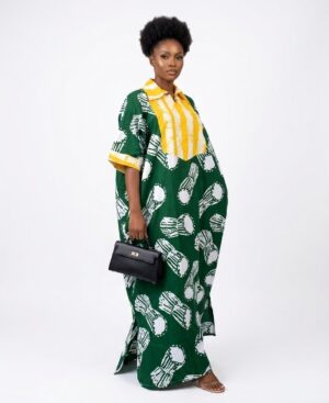 Woman wearing a green and yellow hand-dyed Adire Batik Kaftan dress with a shirt collar.